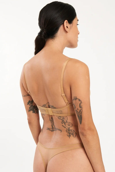 Else Bare Minimal underwire bra and thong in sheer caramel beige mesh. Back view on model showing adjustable straps and hook & closure on bra and low/mid rise waistline of thong. 