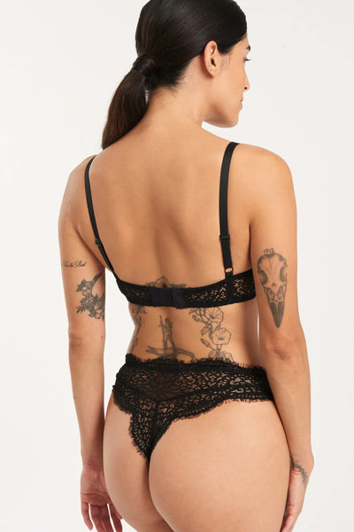Else Monique black lace high waist thong. Back view, shown on model in matching bra. Thong features a tanga-style back with the scalloped edge of the lace on the leg line and waistline. 