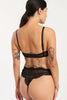 Else Monique black lace underwire bra, back view on model in matching thong. Image shows adjustable thin elastic shoulder straps and hook & eye closure on bra as well as the lace underband. The thong features the scalloped eyelash lace waist and leg lines. 