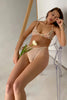 Love & Swans Easy Basic sheer mesh thong in cream beige, front view shown on model in matching bralette. Thong features a mid rise waistline and high, over the hip leg line.
