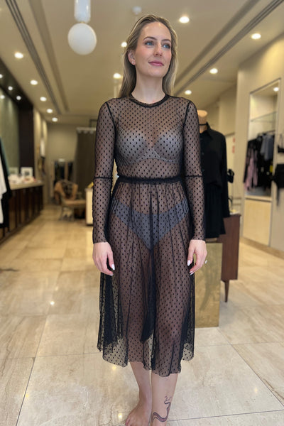 Only Hearts Coucou Lola Natasha Tea Dress in sheer black polka dot mesh. Long sleeve sheer dress with waistband ruffle, shown on model, front view.