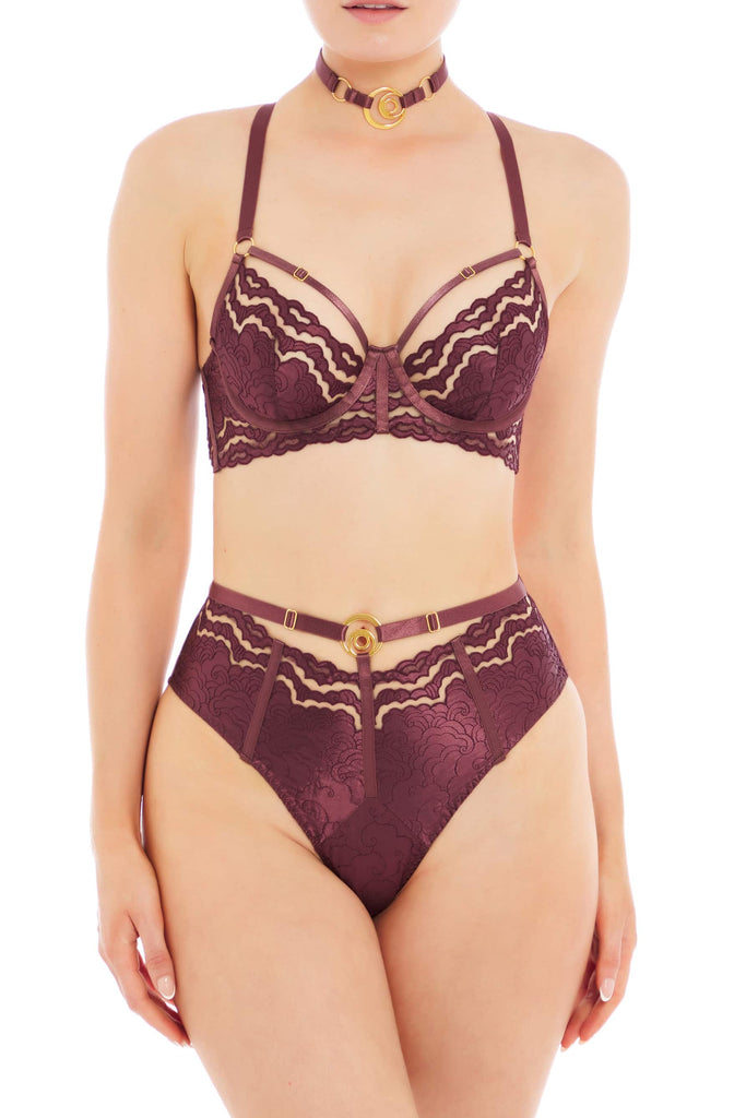 Dark purple plum Dala balconette underwire bra with adjustable cup and shoulder straps by Bordelle. Front view on model with matching collar and high waist brief.