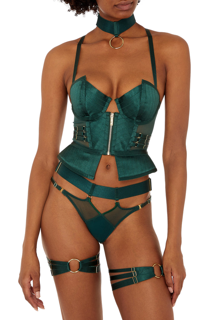 Bordelle Kora Open Back Brief in rich Eden green, shown on model in matching Kora Basque, collar and garters. The Kora brief features a wide satin elastic waistband with gold plated sliders for perfect fit on the hips, with gold plated rings attaching the layered mesh bottom. Low hip narrow elastic straps also have sliders for adjustability.