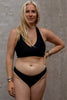 Nero Canggu low rise bikini swim bottom by Copenhagen Cartel. Front view on model with matching Bukit swim top.