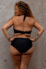 Nero black halter swim top with tie at the back of the neck by Copenhagen Cartel. Back view on model with matching Ubud swim bottom.