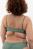 Army green Sanur swim top in army green with skinny adjustable straps by Copenhagen Cartel. Back view on model.