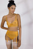 Mango yellow orange Bella garter belt by Else. Front view on model with matching thong, bralette. The garter is attached to white thigh high stockings.