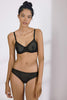 Else Betty black geometric lace underwire bra. Front view on model with matching bikini brief.