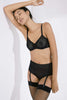 Else Betty black geometric lace underwire bra. Front view on model with matching high waist brief with removable suspenders