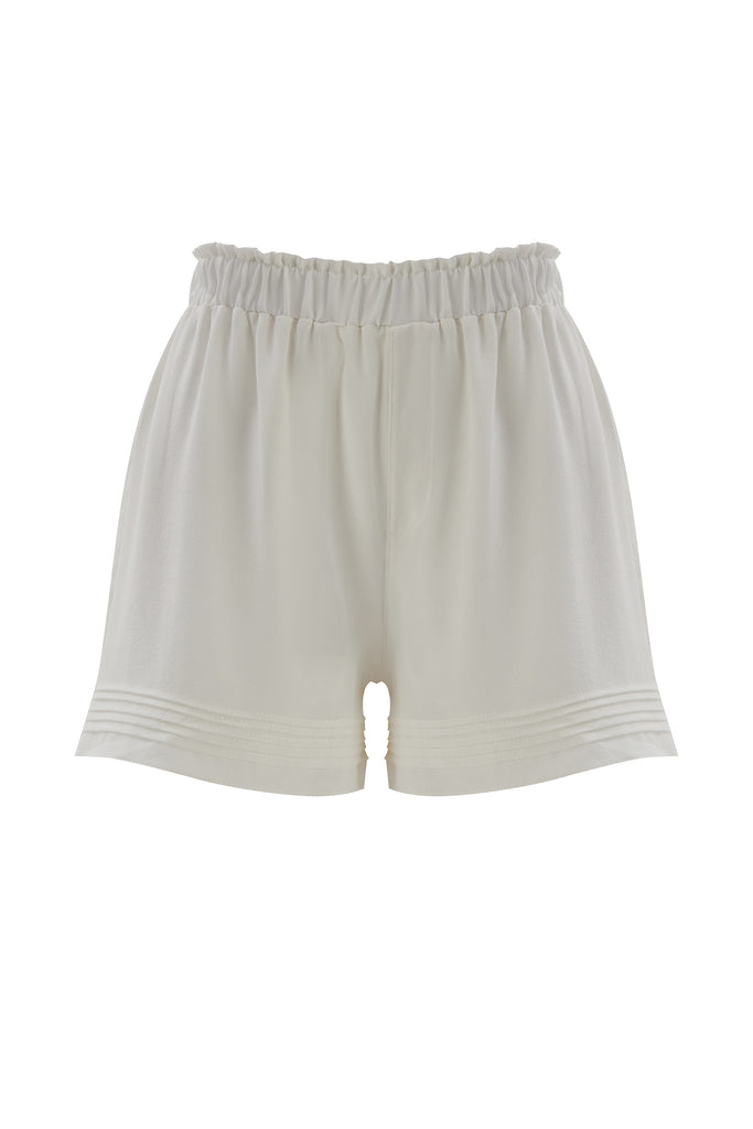 Else Diana silk shorts in off white, front view on plain white background. The shorts have an elastic waistband and pleated detailing at the hemline.