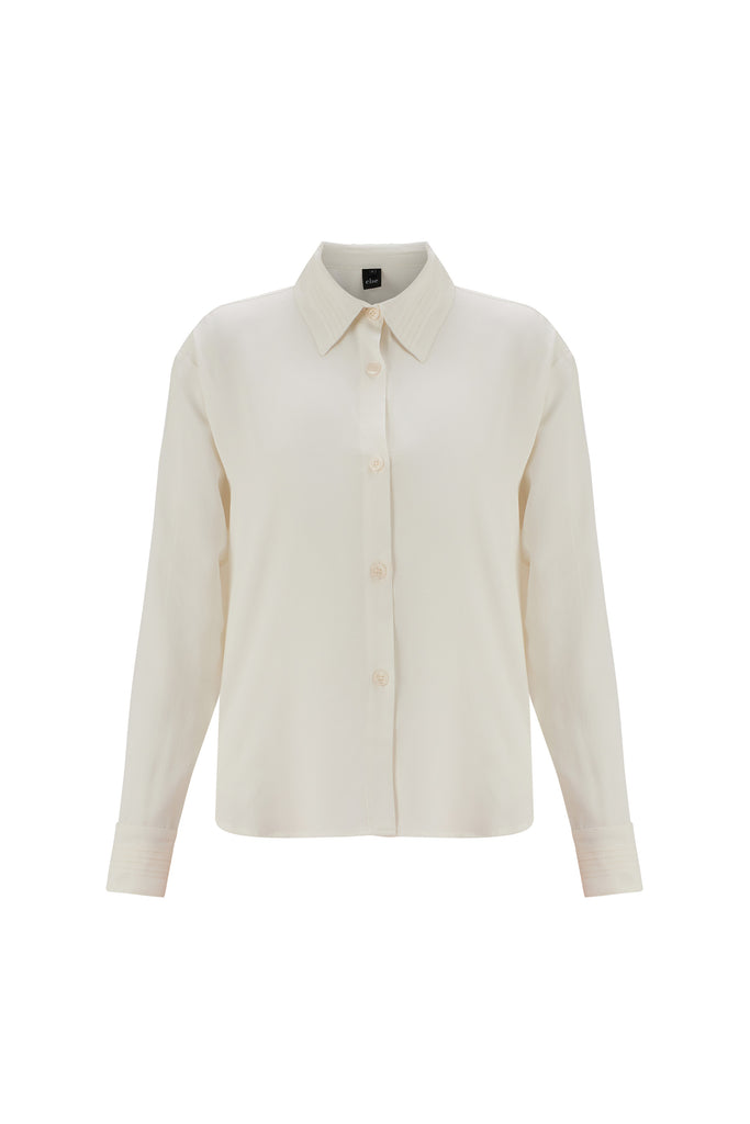 Else Diana silk shirt in off white, front view on plain white background. The shirt buttons up the front, is long sleeved, and features a pleated collar and cuffs.