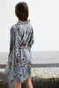 Else Nocturnal Animal silk robe in multicolor blue, purple, yellow and green animal print. Shown on model, back view.