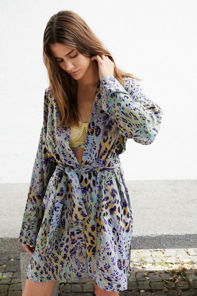 Else Nocturnal Animal silk robe in multicolor blue, purple, yellow and green animal print. Shown on model, front view.