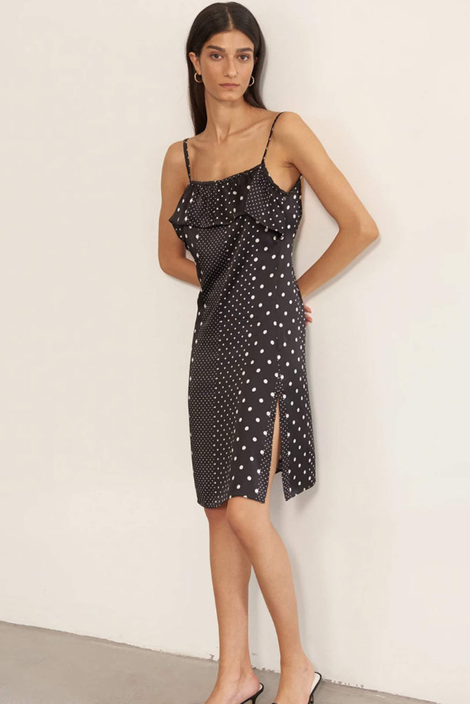 Else Polka Dot silk slip dress in black with white multi sized polka dots and ruffled bustline, front view on model