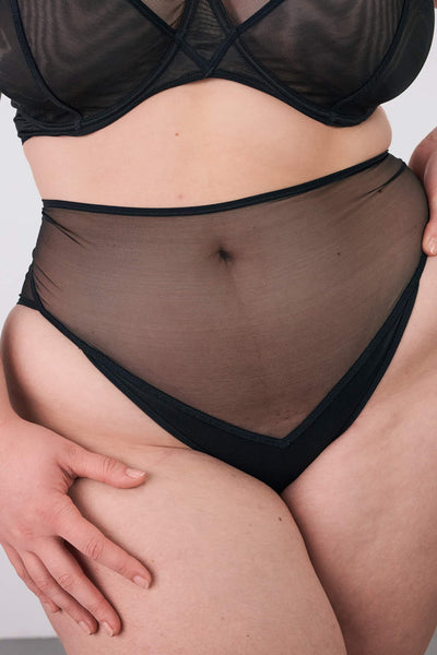 All Talk High Waist black tulle underwear from La Fille d'O. Shown close up front view on model.