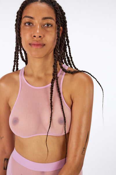 Sheer mesh rose Heroes wireless top with high neck sports bra lines by La fille d'O. Front view on model.