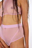 Sheer mesh rose Heroes wireless top by La fille d'O. Front/side view on model.