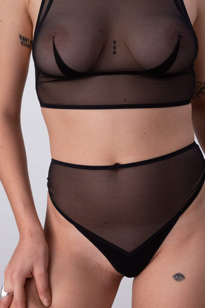 Pierrot sheer black high waist thong by La Fille d'O, close up front view, shown on model