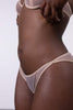 La Fille d'O Sky Seven sheer mesh low rise bikini brief in light beige, close up side view on model