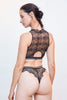 Paloma Casile Billie Crop Top/Bralette in black stretch lace with silver striped elastic underbust band, shown on model, back view, with matching tanga thong