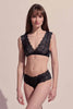 Front view of model wearing the lace Polly Brief by Paloma Casile La Nuit and matching Polly Bralette. The brief is a low rise design with boyshort style bottom.