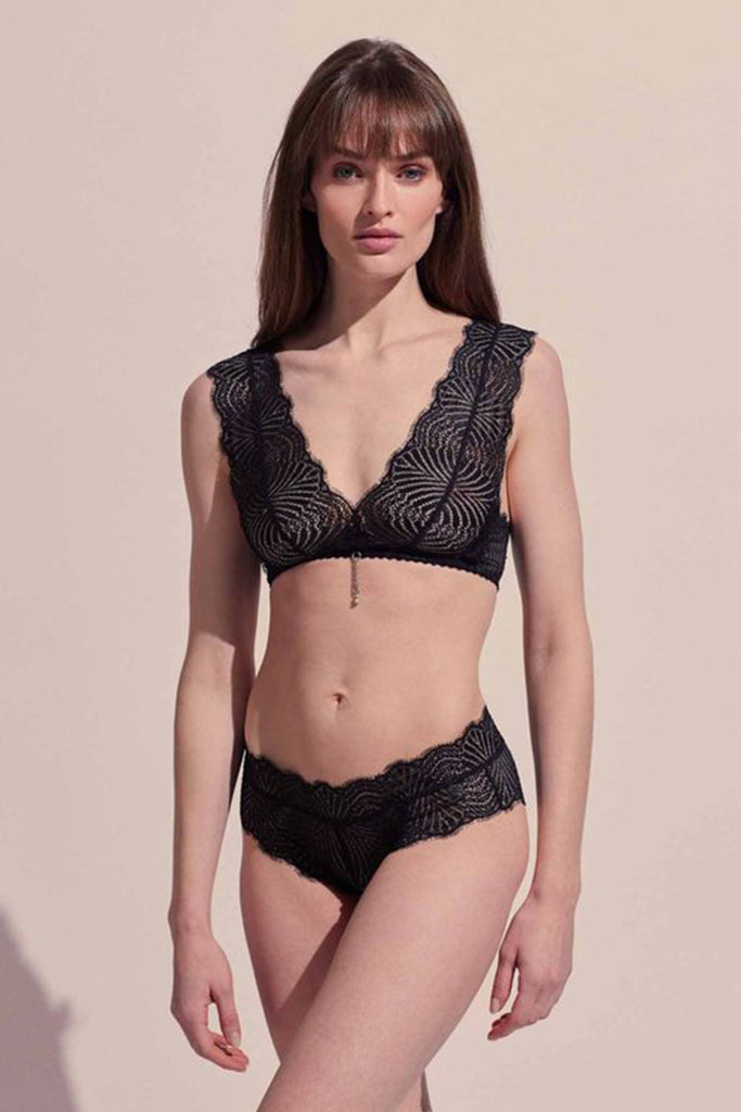 Front view of model wearing the lace Polly Brief by Paloma Casile La Nuit and matching Polly Bralette. The brief is a low rise design with boyshort style bottom.