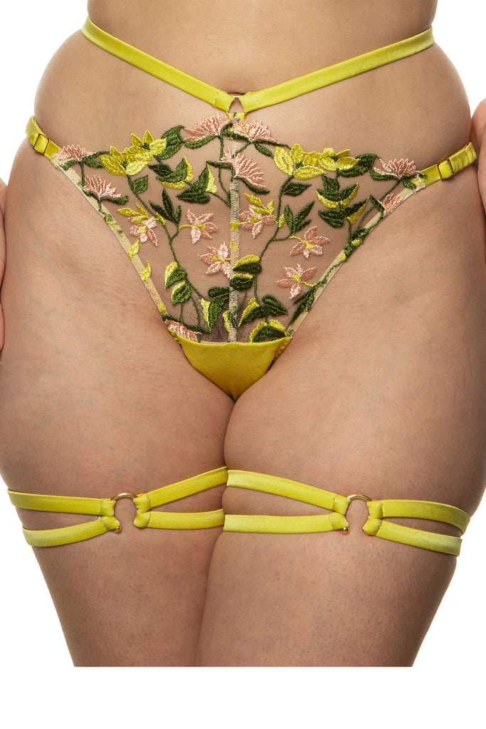 Floral embroidered Liana waist strap knicker by Studio Pia with chartreuse straps and gold plated hardware. Front view on model with matching garters.