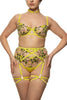 Chartreuse strap thong with springy floral embroidery by Studio Pia. Front view on model with matching bra, harness suspender, and garters.
