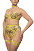 Liana chartreuse harness suspender with springy floral embroidery and gold hardware by Studio Pia. Front view on model with matching yellow green bra, collar, and strap thong.