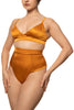 Amber orange high Petra soft cup bralette by Studio Pia. Front/side view on model with matching high waist thong shows the silky sheen of the fabric.