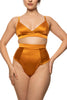 Amber orange high waist thong by Studio Pia. Front view on model with matching soft bra shows the silky sheen of the fabric.