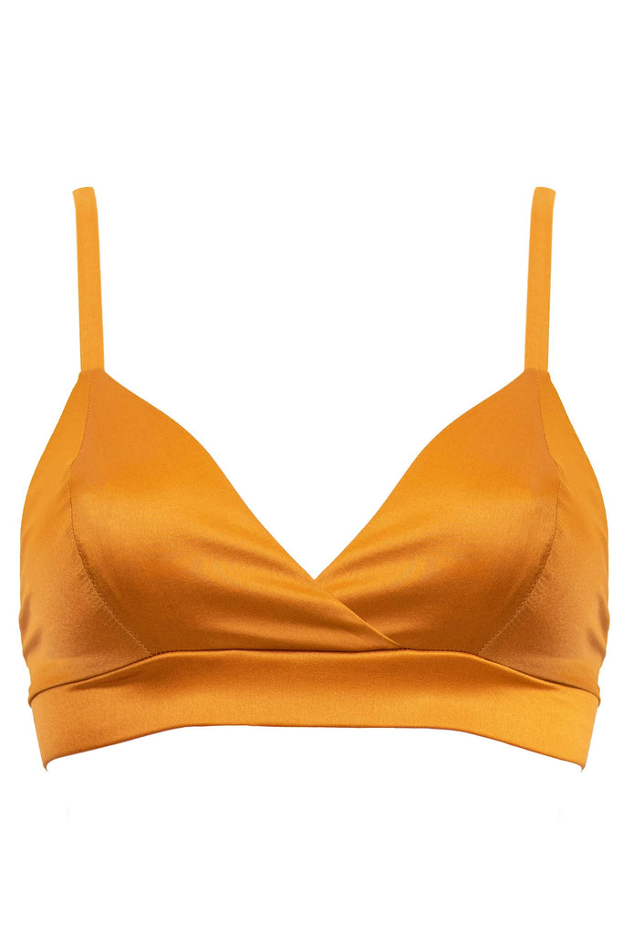 Amber orange Petra soft cup bralette by Studio Pia. Front view on plain white background.
