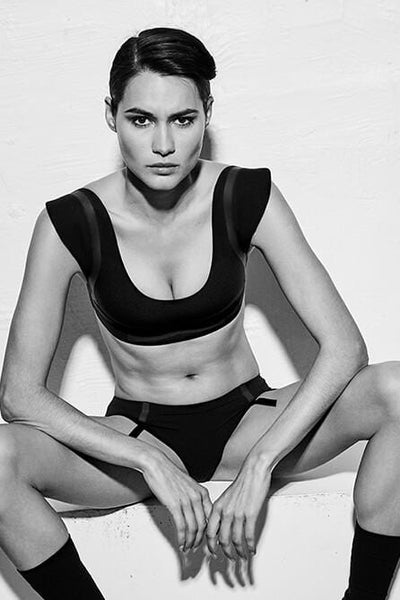 Ruban Noir "Déjeuner Horizontal" Swim/Underwear Boyshort Brief, on seated model, with matching swim/bra top