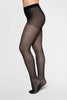 Swedish Stockings Saga tights in sheer black with a silver glittery seam up the back. Shown on model, side view, on plain white/gray background