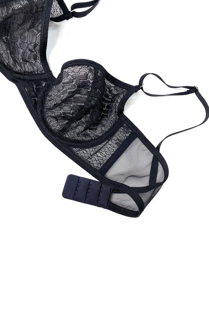 Sheer black Cruz underwire balcony bra with crocodile patterning on the mesh. Partial front view of Taryn Winters bra on white background.