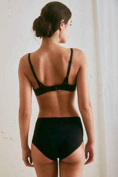 The Great Eros Lugano High Waist Brief in black, shown on model, back view