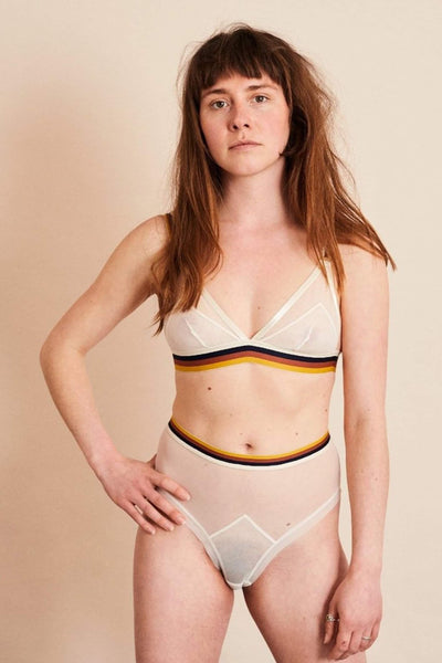 The Underargument Make Yourself Home High Waist Briefs in sheer ivory mesh with striped elastic waistband, front view on model