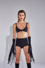 Ruban Noir knot front bralette in black, shown on model, front view, with matching fringe gloves and high waisted briefs
