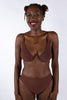 La Fille d'O Savage mid-high waist sheer mesh brief in chocolate brown. Minimal, high leg silhouette. Front view on model wearing matching Fast Girls monowire plunge bra. 