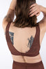 La Fille d'O Ramble On sheer mesh wireless bralette in chocolate brown. Back view on model showing deep plunge back and metal clasp closure at center.